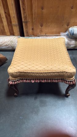 Coffee table with upholstery on top