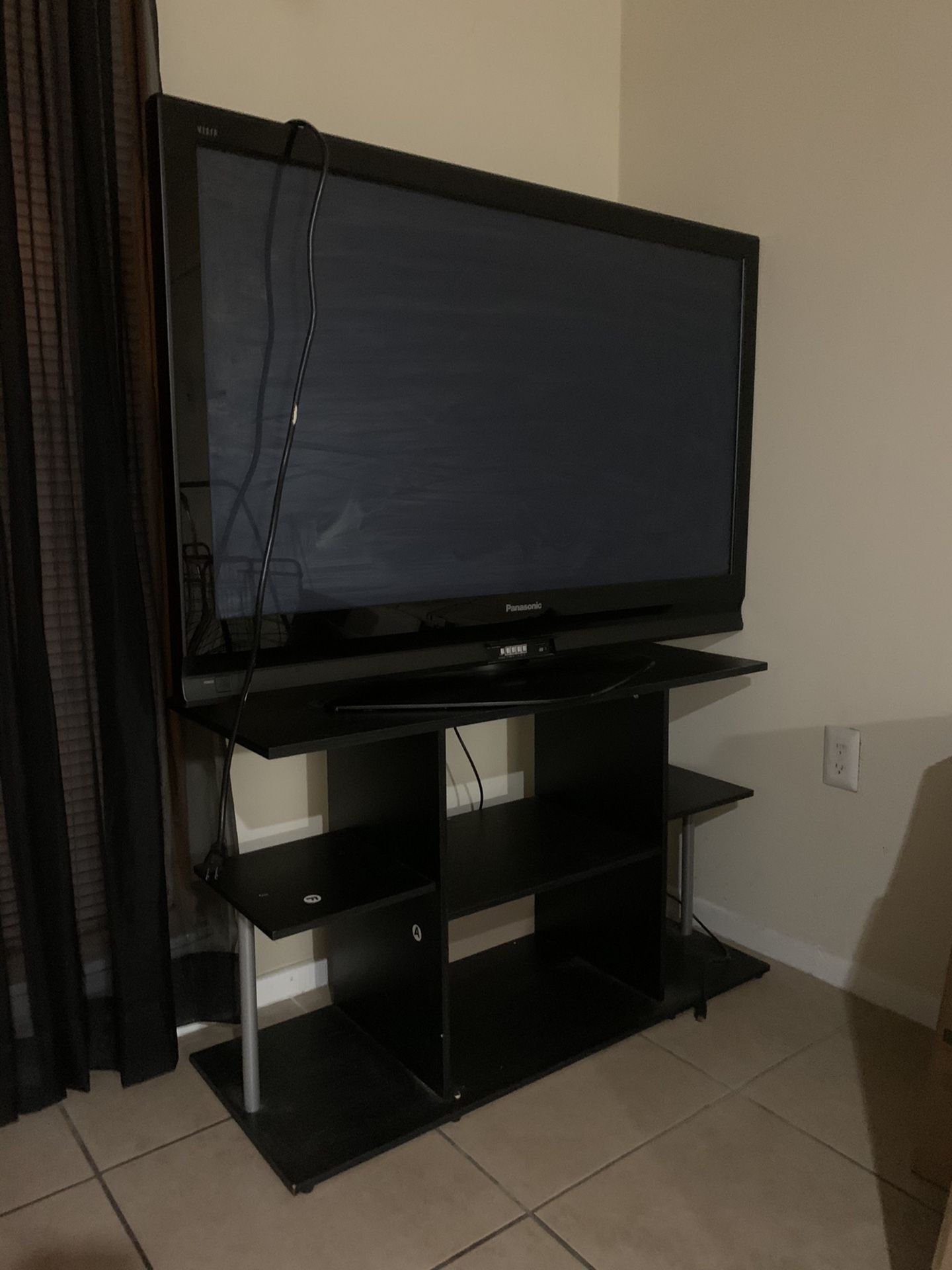 Black 55’ TV with stand 📺!