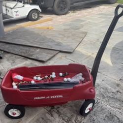 Red wagon radio flyer plastic 2 seater can open / lift up or put down seats to lye do
