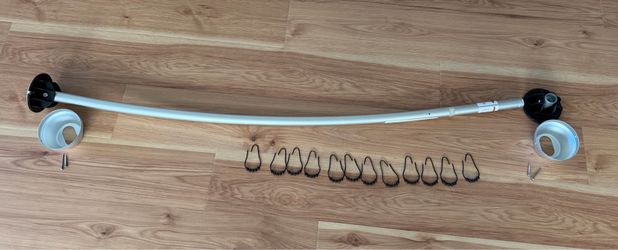 Curved shower curtain rod w/ shower curtain rings