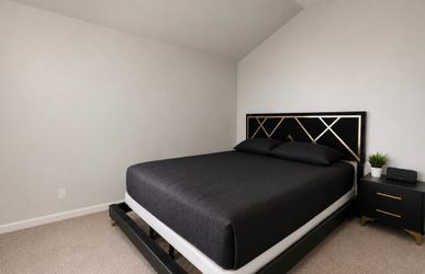 King size bed frame with a box spring and two nightstands