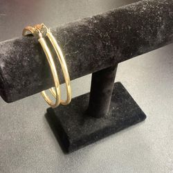 argollas enchapadas en oro no negociable