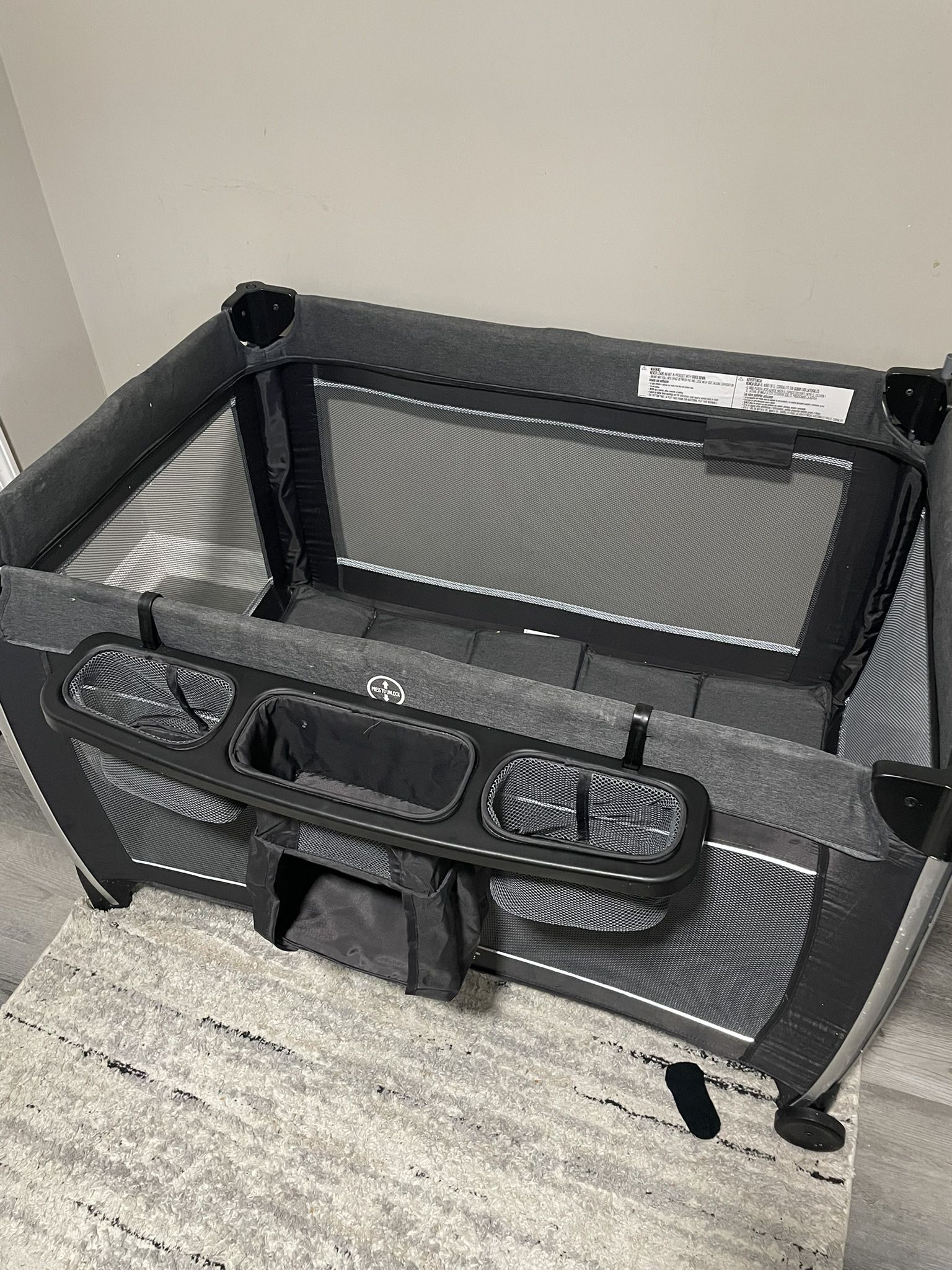 Pack n Play with diaper compartment.