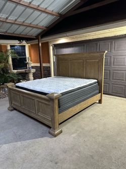 Beautiful king size bed frame super heavy with mattress and box springs in great condition asking 550