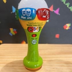 LEAP FROG SHAKE AND GRIOVE COLORFUL MARACAS ! TEACH IN ENGLISH AND SPANISH!  CUTE MICROPHONE STYLE TOY!! 