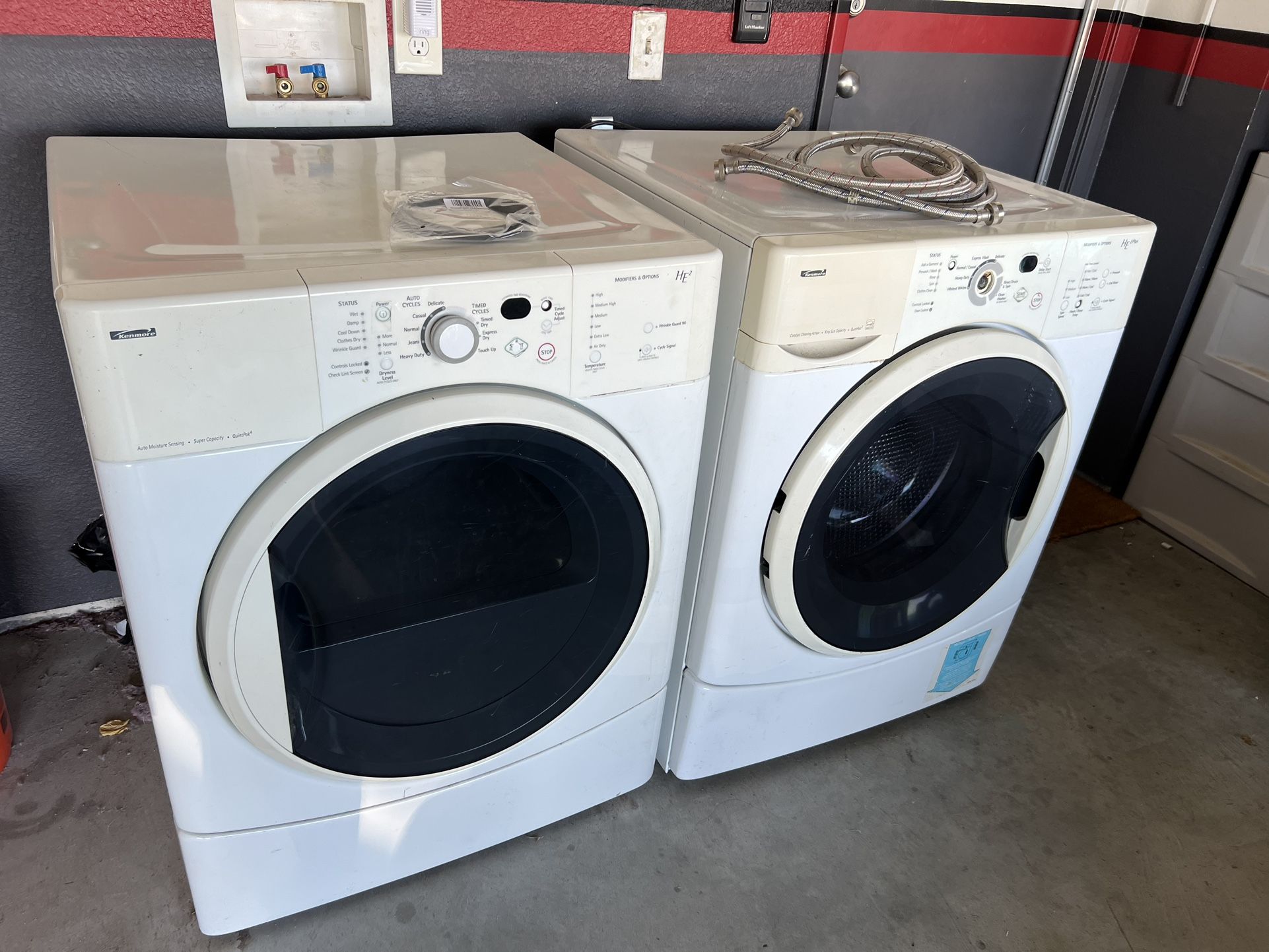 Kenmore front load stackable working gas dryer and washer machine.