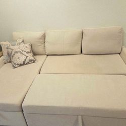 Sectional with two pillows and storage