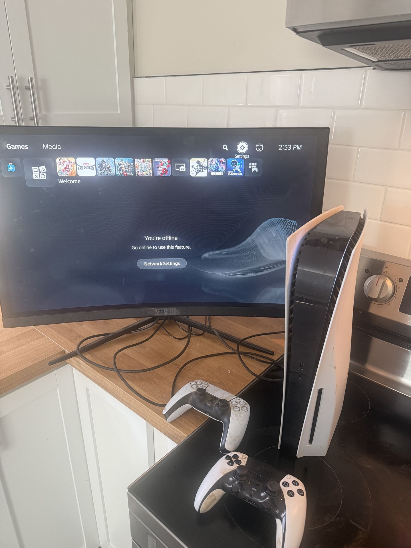 Playstation 5, A Gaming Monitor, A Playstation Five Controller, and a PlayStation five pro controller