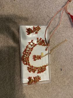 Red and gold Indian jewelry. Necklace and earring set