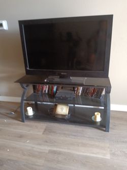 Every Thing You See 50.00 41"Flat Screen  DVD   Black Glass Stand . 50 Dvds 