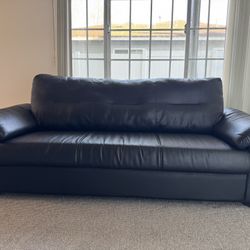 Genuine black leather couch, great condition, hardly used