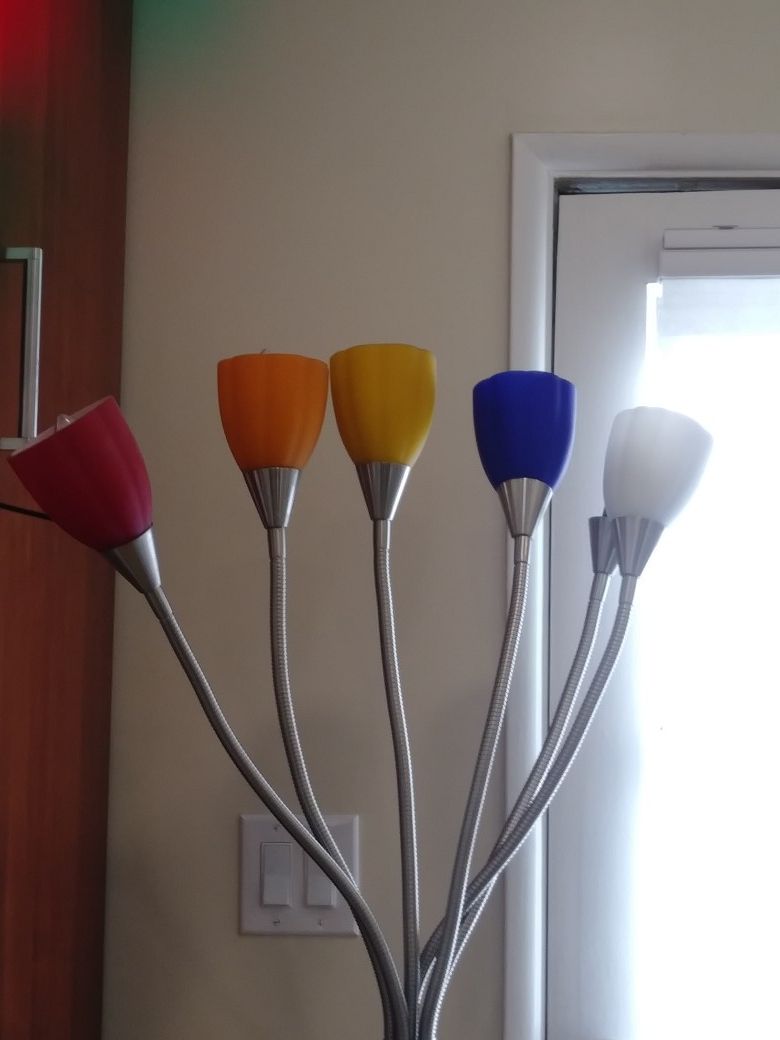 Six armed, glass and aluminum floor lamp. Flexible arms on this modern floor lamp. Red, orange, yellow, blue glass shades.