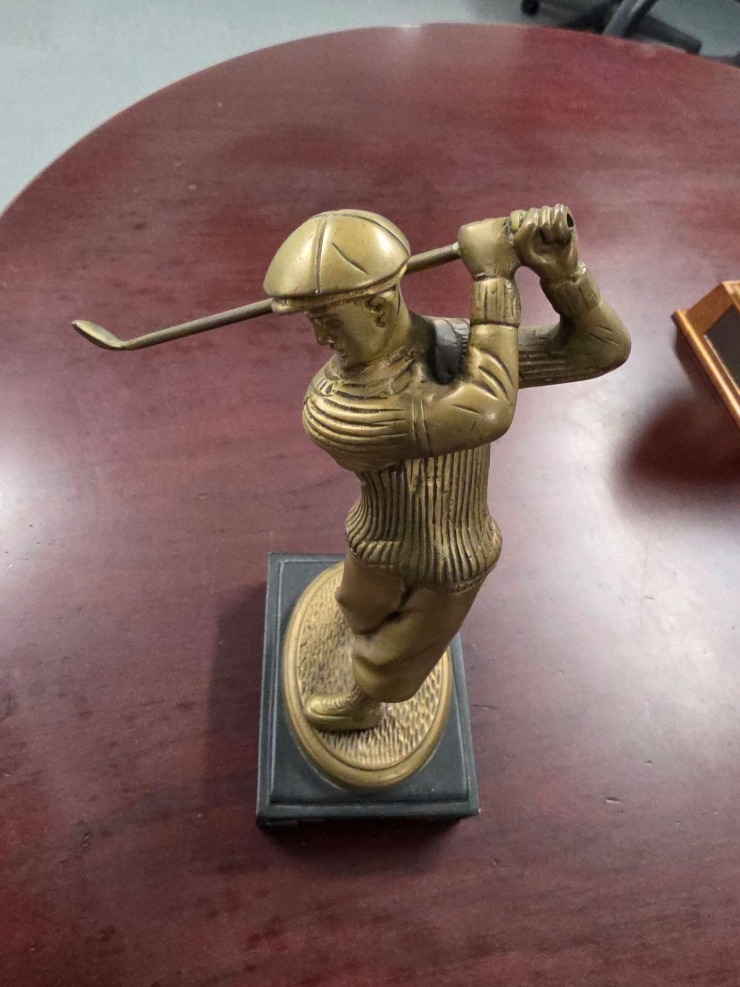 Brass golf sculpture