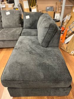 Dark gray upholstered corner sofa