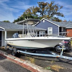  2001 19ft Pro Sport cc with hard top and rocket launchers with home made trailer with registration.