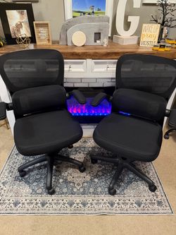 Set of 2 matching black ergonomic office chairs