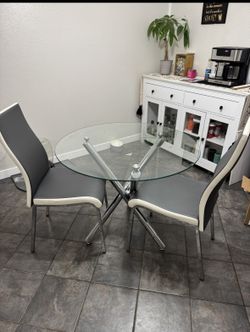 Round Glass Dining Table And Chairs