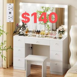 Dressing table with illuminated mirror