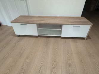 SModern media console has a wood-grain laminate top with white cabinet doors (WxDxH): 71 x 19.5 x 17 in