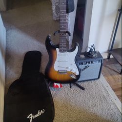 Fender Squire Starter Guitar w/Fender Amp, Carrying Case, Shoulder Strap, Tuner, And All Necessary Cords.