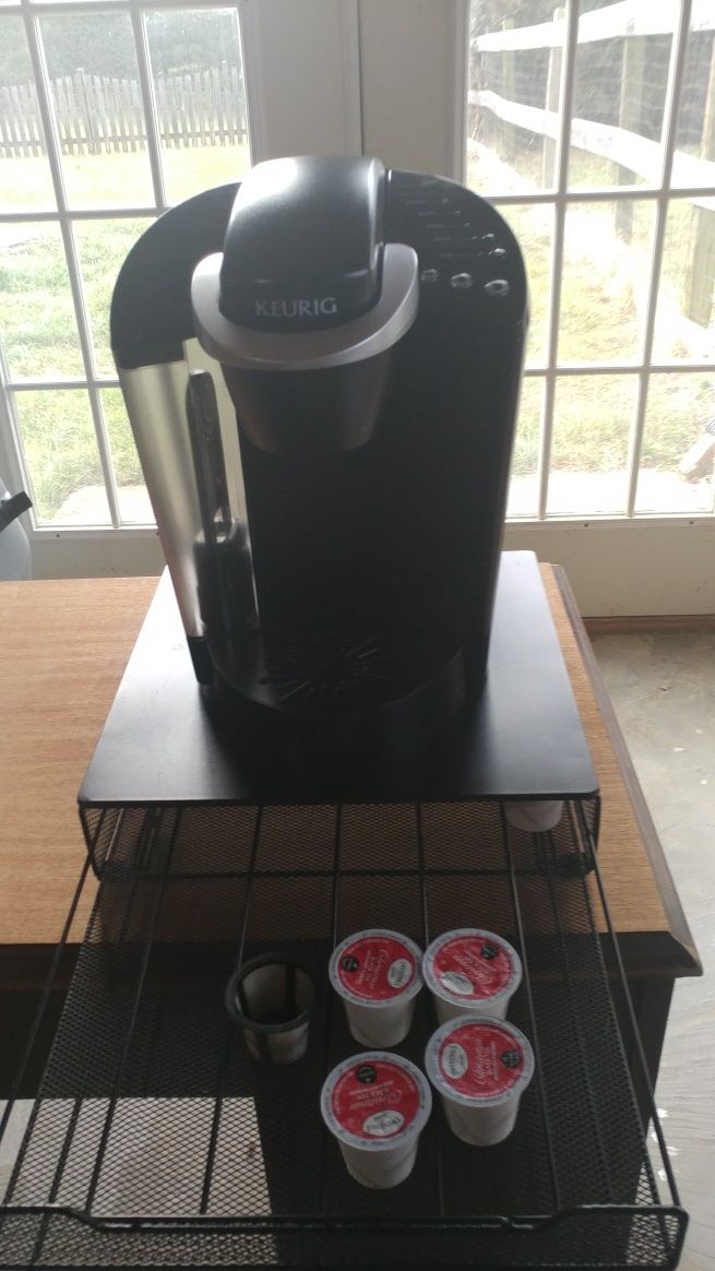 Keurig cup coffee maker w/ cup storage stand.