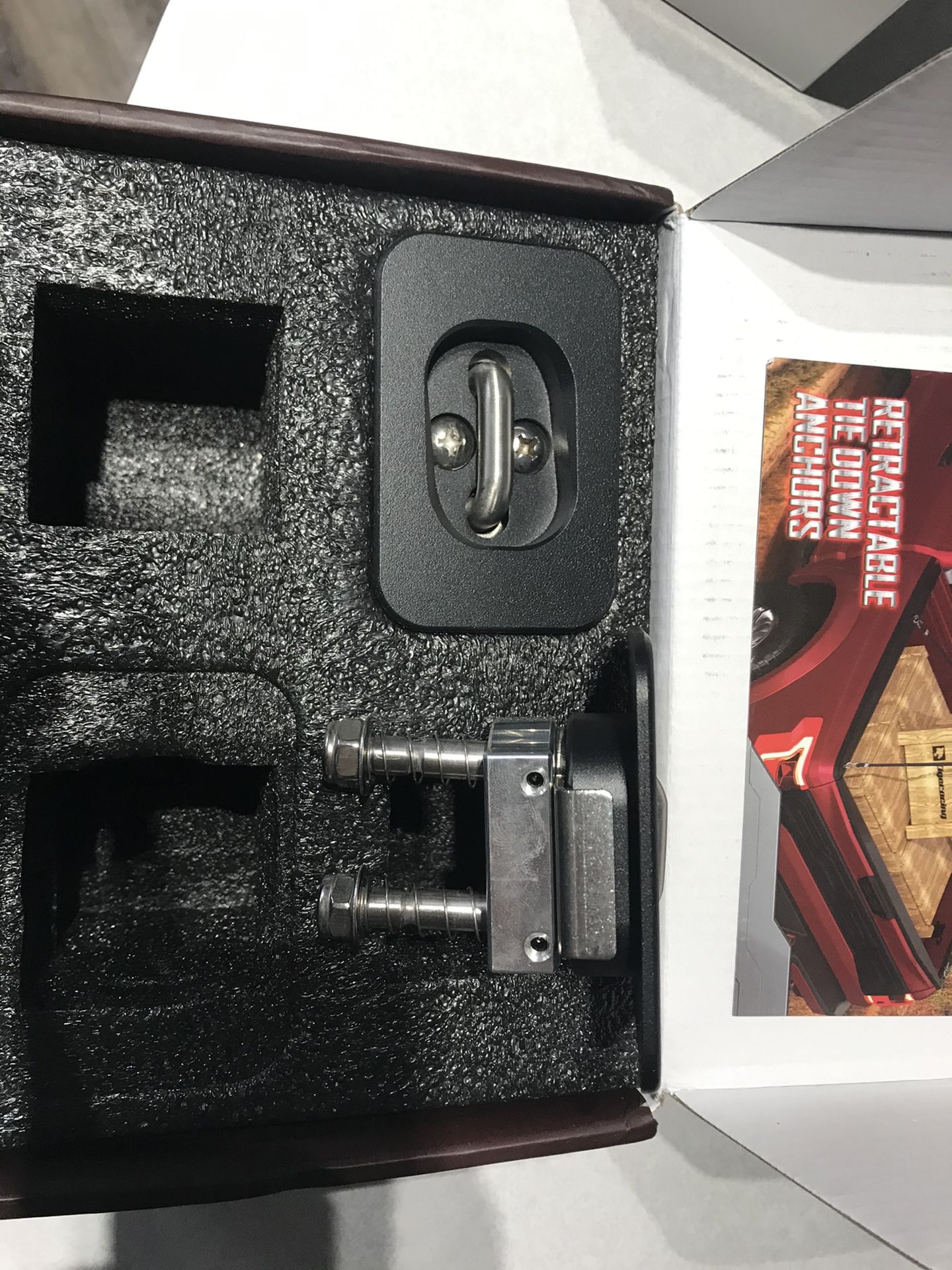 Retractable tie down anchors