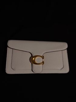 White and gold coach bag