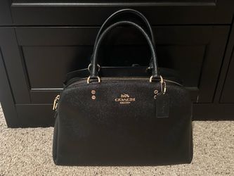 Coach bag. Comes with the long strap.