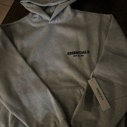 Essential hoodie dark oat sizes medium and large