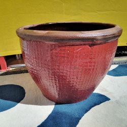 Nice heavy ceramic pot. Reddish burgundy color. Measurements are 30-in round x 26-in high.