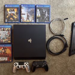PS4 Pro w/ Vertical Stand, 5 Games, and 2 controllers 