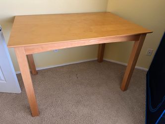 Wood table with removable leaf
