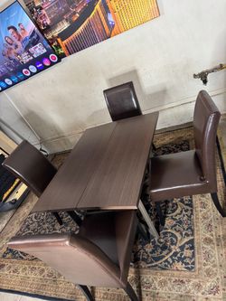 * Gently Used * fold down dining table & 4 chairs ( Free Delivery )