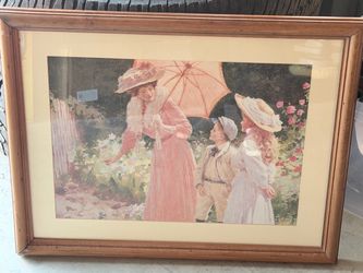 This framed print is a reproduction of "A Lady with a Parasol showing how to make a barrel