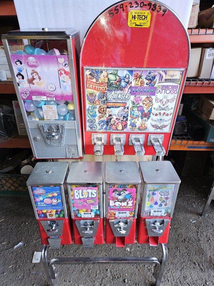 2 Bulk Vending Machines On Rack. Location Ready. Includes Prododucts, Gum, TATTOOS,Etc. All Works Fine. Ready to make $$$$ Reoccurring Revenues, week