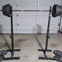 Squat rack, bar, and 200lbs of weights