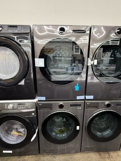New open box LG Charcoal front load washer and gas dryer set