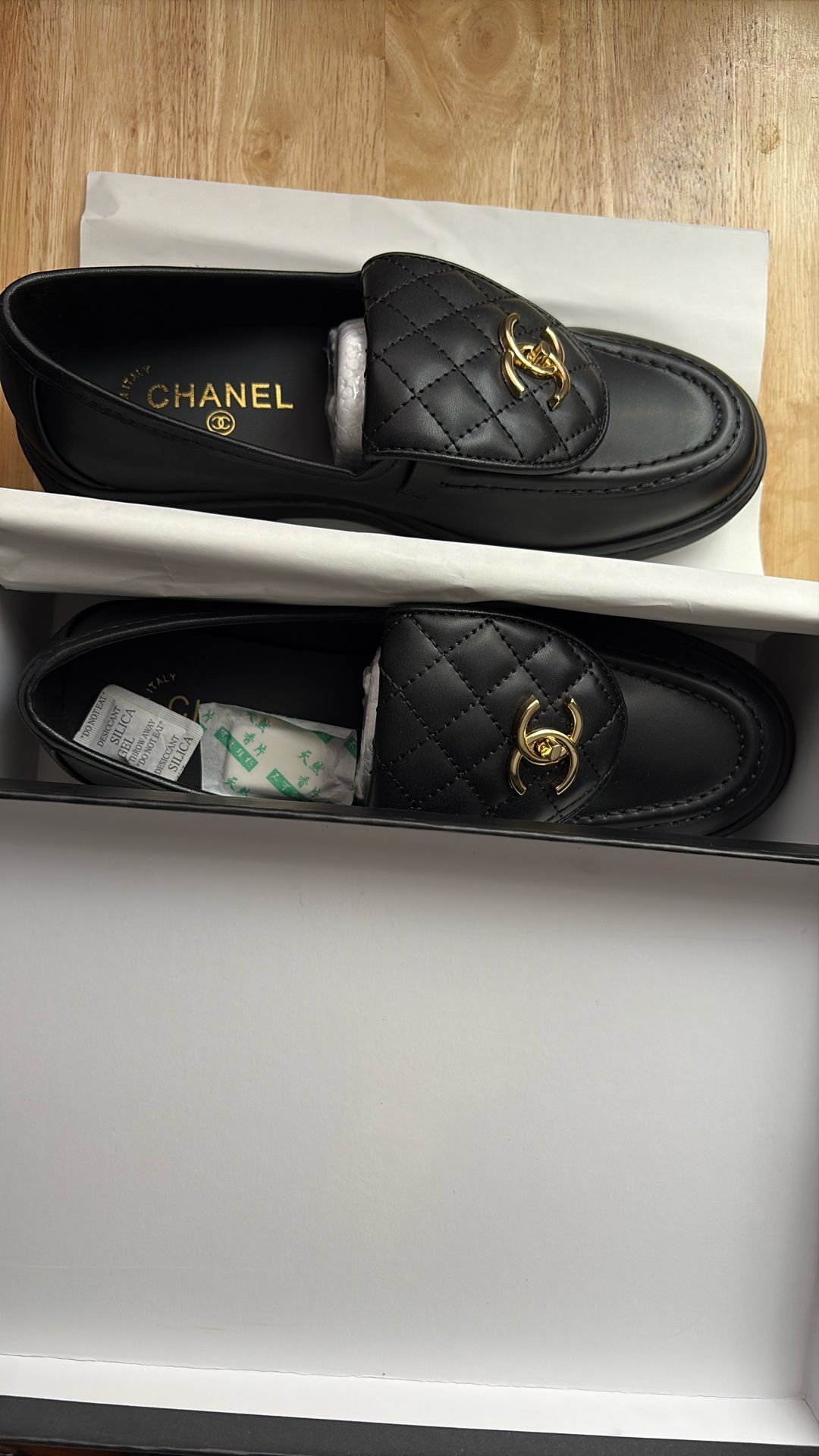 Black leather Chanel loafers