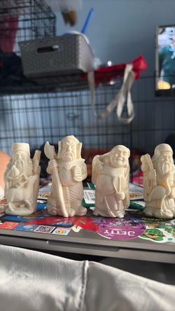 Four Chinese lil statues