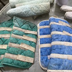 Assorted leg wraps and ankle boots for horses