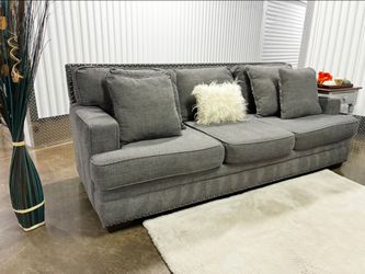 Ashley Furniture Signature By Design Sofa With Accent Nailhead Trim Including Delivery and Matching Pillows