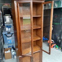 One Wooden China Cabinet With Openings.