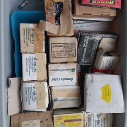 brad nails finish nails Staples coated flux core wire weld half price I think there's about 15 boxes here at 50 bucks a box I took half of that at 375