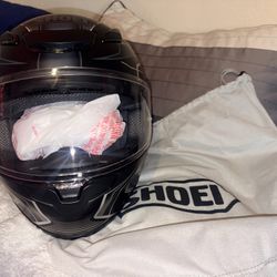 Shoei RF-1400 full-face motorcycle helmet. 