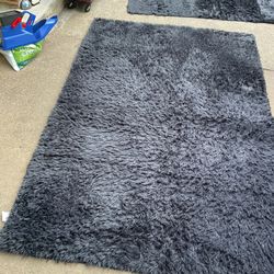 Two Beautiful, Black Rugs (100” X 61”) (72” X 49”) In Good Conditions, Need A Little Cleaning (NO SHIPPING)$20, And $15