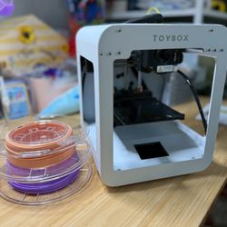 TOYBOX 3D printer. Comes with peach and grape “food” and yellow in machine