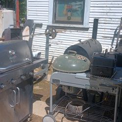 Several Different Bbqs And Smokers