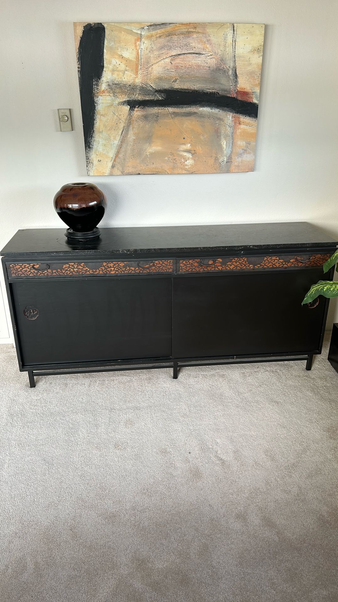 Asian cabinet with metal inlays on drawers