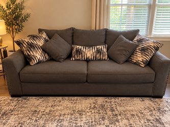 Gray sofa and Wingback Accent Chair with Nailhead Trim