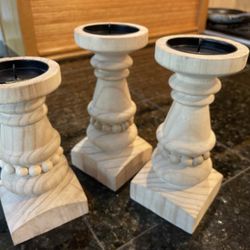 A Trio Of Wood Candle Holders